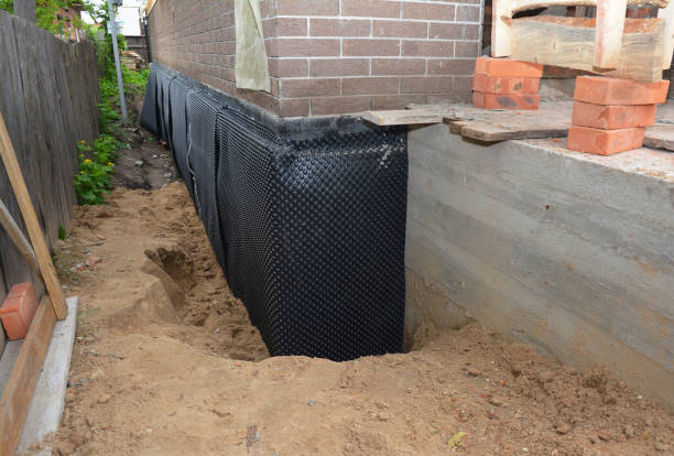 Happy homeowners after waterproofing job in Falkville
